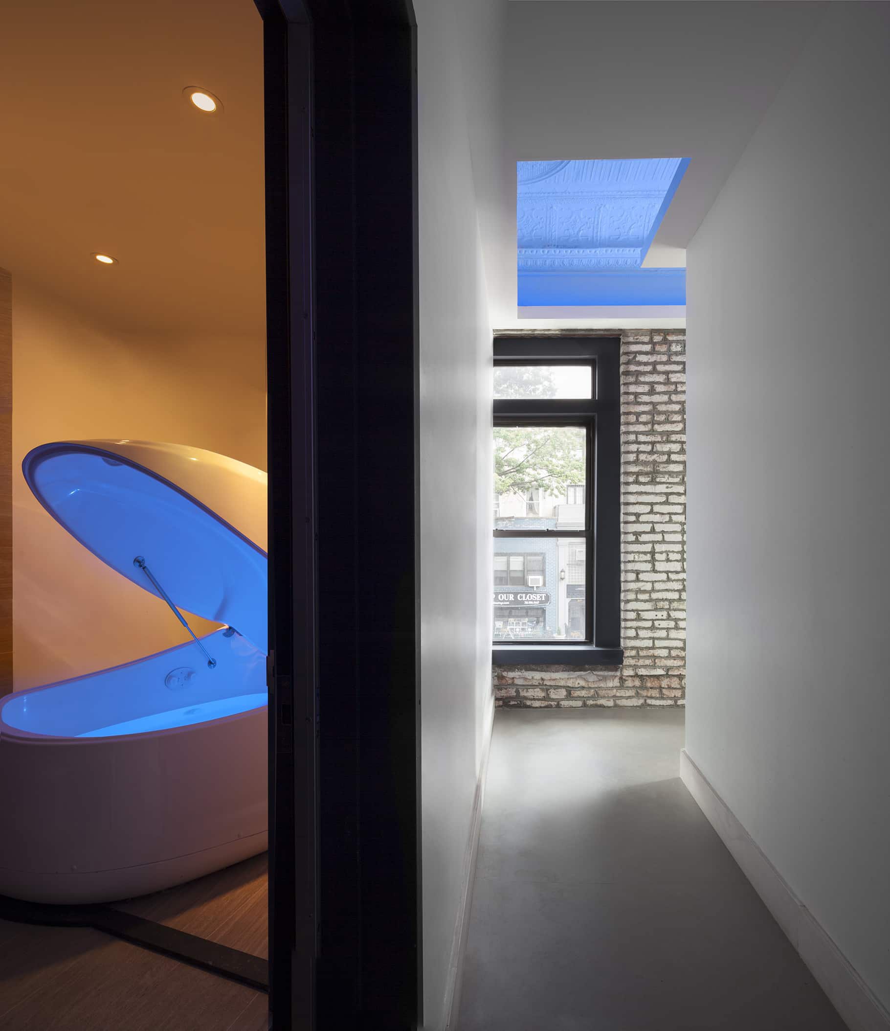 NYC Architect Architecture Modern Wellness Design Float Spa Commercial Renovate Renovation Flotation Therapy Exposed Brick Blue Light Flotation Pod